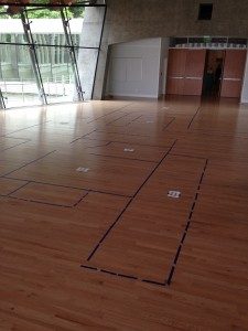 The floor plan of the Bachman Wilson House mapped out in tape on the floor of the Museum's Great Hall. 