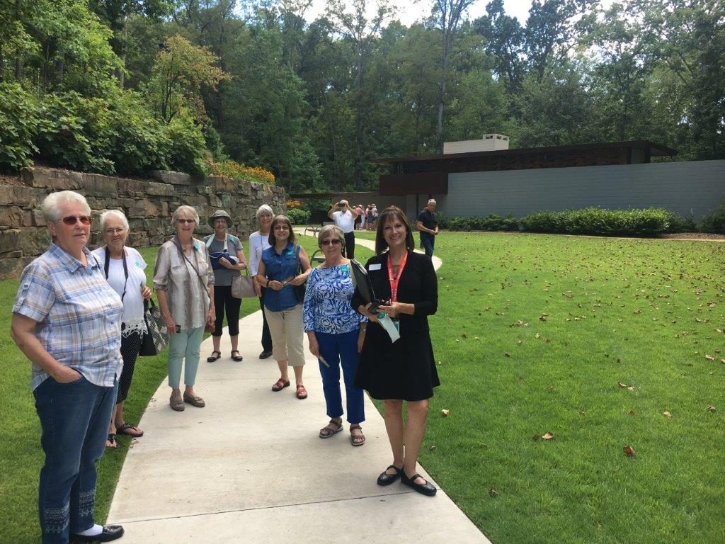 Staff member Carol Roberts leads a tour group at the Frank Lloyd Wright House