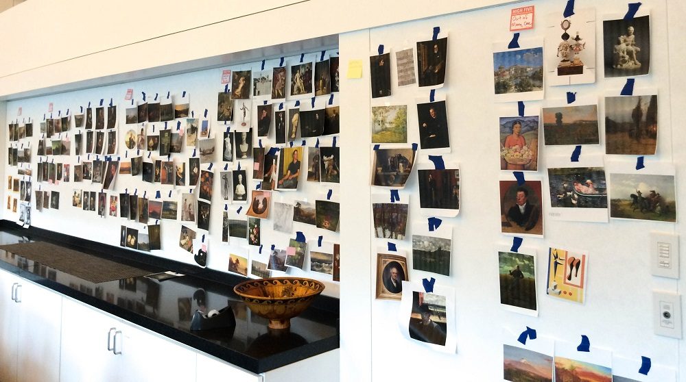 Walls in the Museum's Curatorial offices are covered with printed images of every work in Crystal Bridges' Colonial and Early Nineteenth Century Gallery, as the exhibition and interpretation teams work out how they want the works to be grouped in the final gallery layout. 