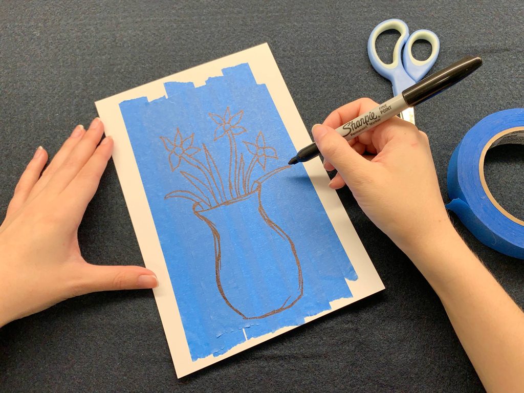 a person drawing a vase with flowers on a canvas of tape strips