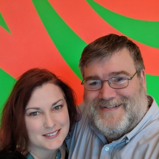 a male/female couple poses in front of loopy doopy by sol lewitt