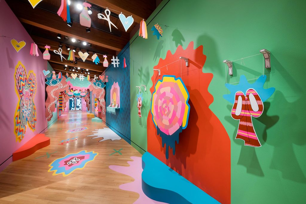 Julie Alpert: Altars, Keepsakes, Squiggles, and Bows; pink, blue, green, and other bright colors in julie alpert's installation in the contemporary art gallery