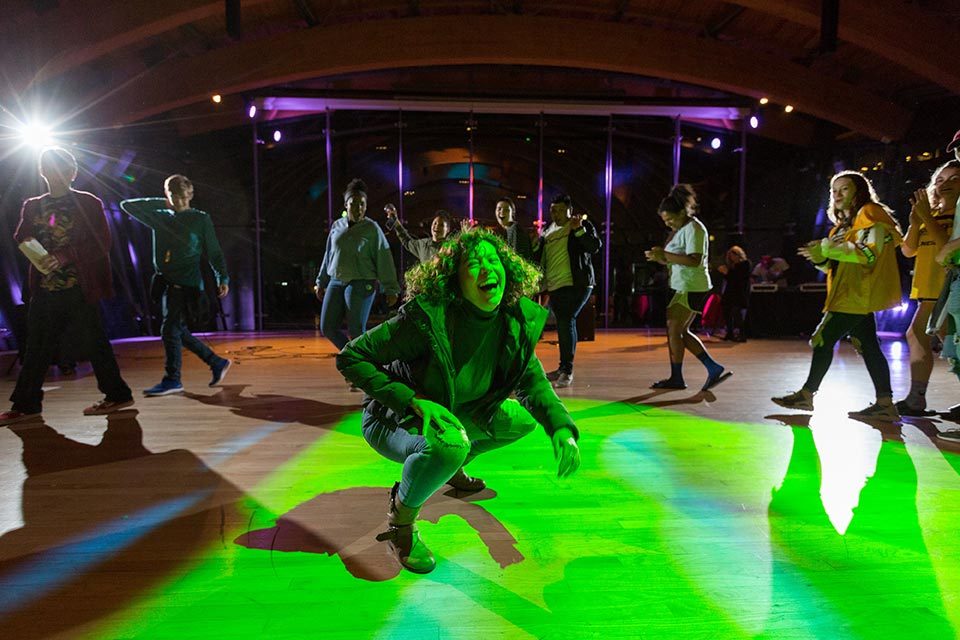 Teens dancing in the museum Great Hall at night