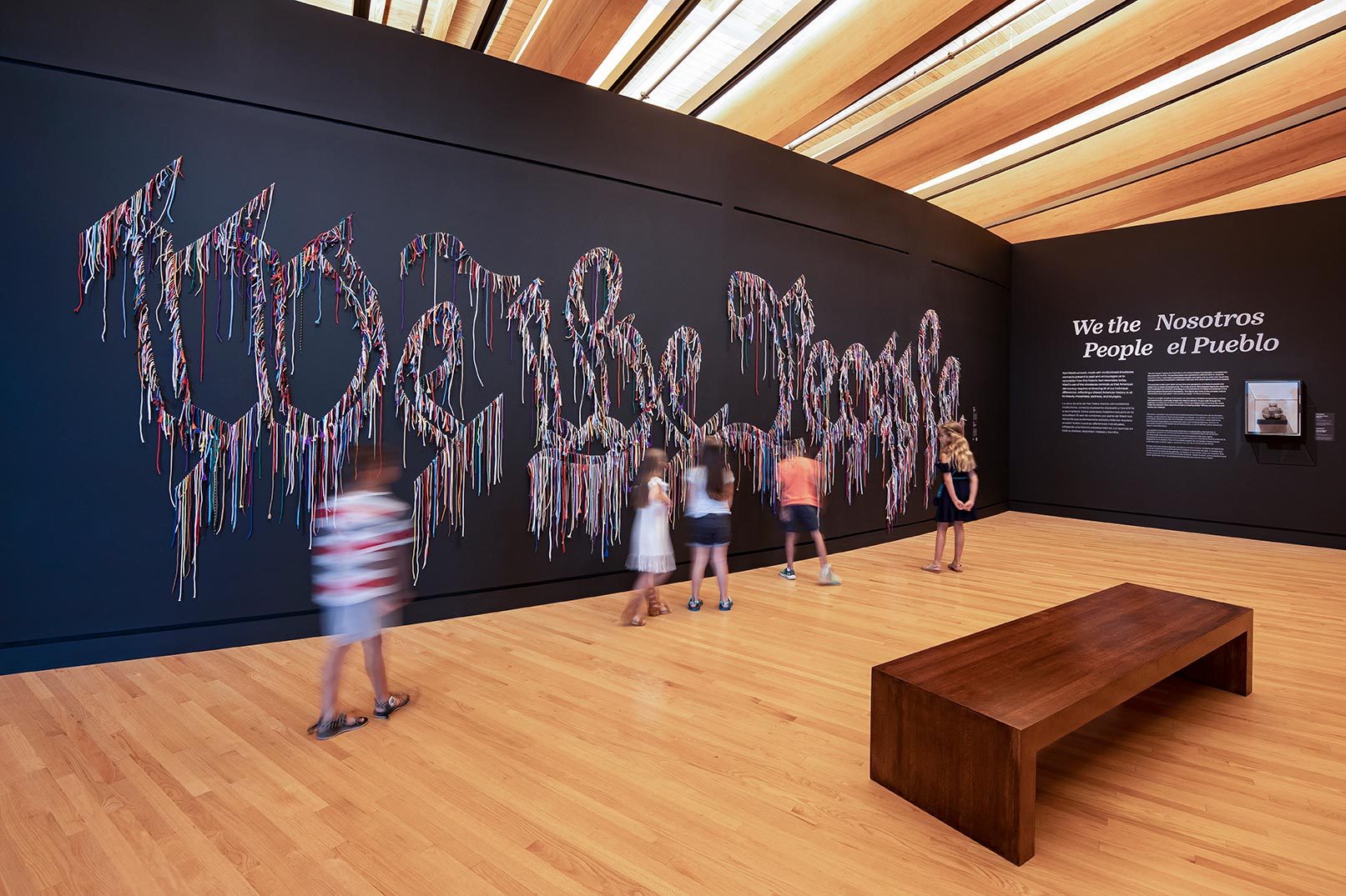 Children viewing the artwork We the People