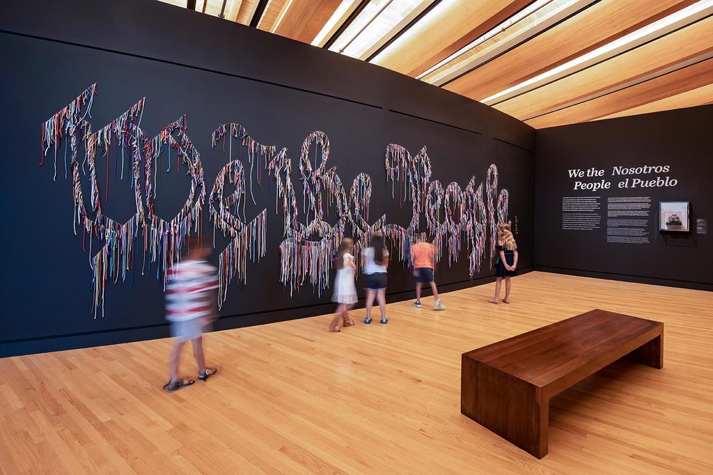 Children viewing the artwork We the People