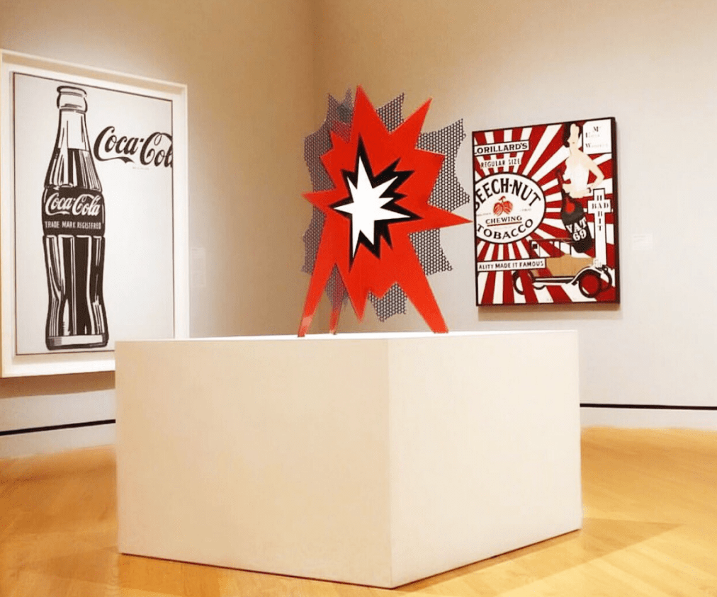 Image from an installation in our galleries in 2016. Roy Lichtenstein, Standing Explosion (Red), 1965, porcelain enamel on steel, 38 x 25 x 30 in. Crystal Bridges Museum of American Art, Bentonville, Arkansas, 2010.8.