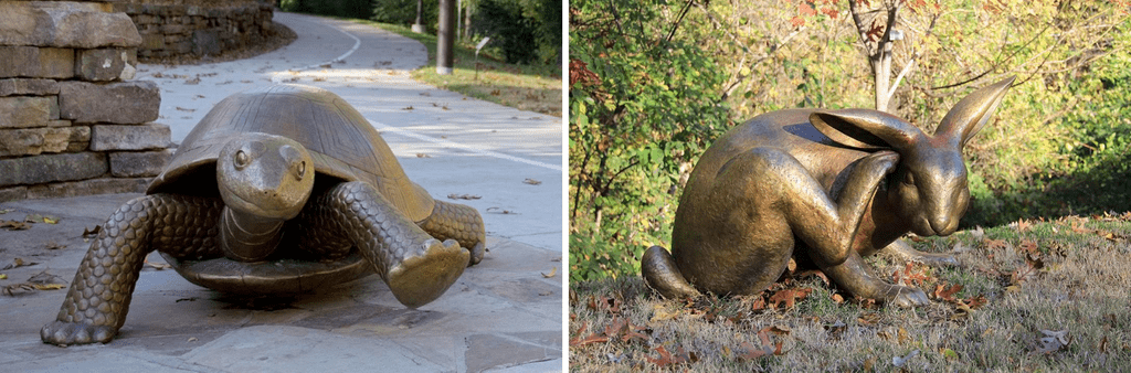 Outdoor bronze sculptures of tortoise on walkway, hare on grass, with natural backdrops.